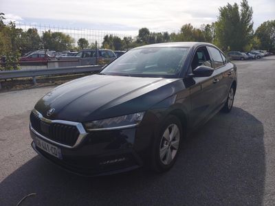 a picture of a black car parked on the side of the road