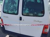 a van that has been vandalized with bullet holes on it