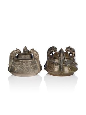 pair of chinese bronze figurines of elephants on a rock