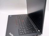 a laptop with a black keyboard on a white surface