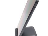 a phone that is sitting on top of a stand