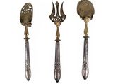 three different types of spoons and spatens on a white surface