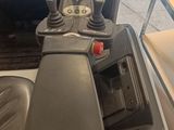 an image of a man driving a forklift truck