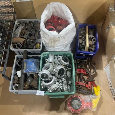many different types of tools in a box on the floor