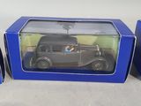 two boxes with a toy car inside of them