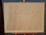a wooden easel with a drawing of a smiling face on it