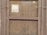 an old window with a wooden frame and a rope hanging from it