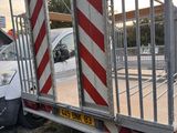 a truck that has a gate on the back of it