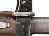 a close up of a knife on a metal pole