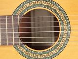 an image of a close up of a guitar with a reflection in it