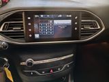 the dashboard of a car with a digital display in the center of it