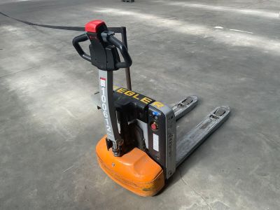a forklift that is sitting in a parking lot