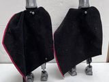 two black and red capes sitting on top of each other