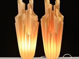 two lamps that are sitting on a table
