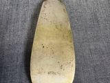 an old spoon that is sitting on a table