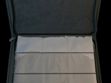 an open suitcase with a sheet of paper inside of it