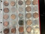 an open book with a bunch of coins in it on a table