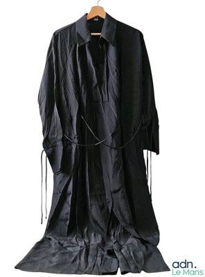an image of a black coat is hanging on a hanger