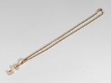 collier plaqué or avec un pendentif en forme de croix et une perle, monté sur une chaîne
