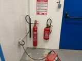 a fire extinguisher in the corner of a room