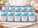 several packages of bath products sitting on top of a towel