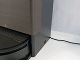 an image of a black toilet with a black lid