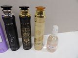 several different types of perfumes are lined up on a counter