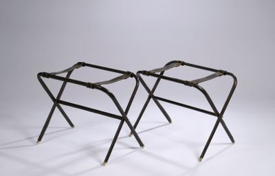 pair of black folding stools with metal legs on a white background