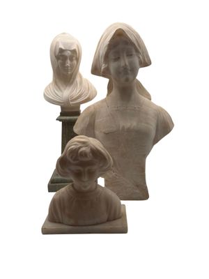 three busturines of women and a man on a pedestal