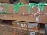 many boxes stacked on top of each other in a warehouse