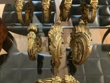 a glass table with a bunch of gold items on it