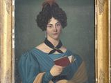 tableau représentant une femme tenant un livre, dans un cadre doré