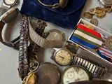 many different types of watches and bracelets on the table