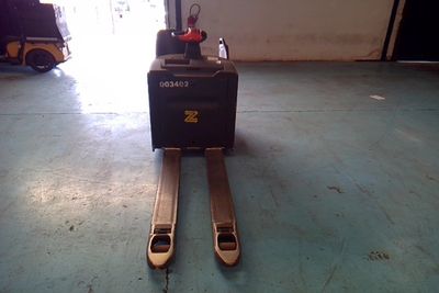 a forklift that is sitting in the middle of the floor