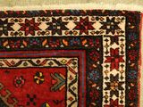 a rug with a red and blue design on it