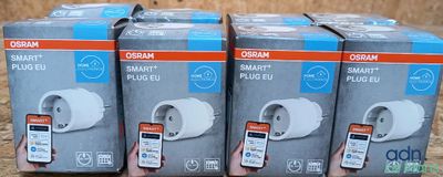 three boxes of garmin smart plugs sitting on top of each other