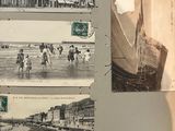 an old photo of a book with pictures of people on the pages