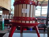 a picture of a wine press on display in a store