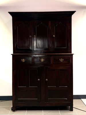 an image of a wooden cabinet in a room