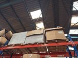 a large amount of boxes on a shelf in a warehouse