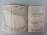 an open book with a drawing of a map on it