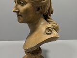a close up of a bust of a woman on a table