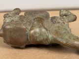 bronze figurine of a turtle with two babies on it ' s back