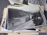 several old black and white photos of a dirt road in the mountains