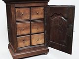 a wooden cabinet with a door open on a white background
