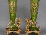 pair of green and gold vases with figures on them