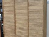 an image of a wooden cabinet in a room