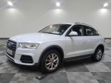 the white audi suv is parked on a checkered tile floor