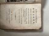 an old book with a picture of a man riding a horse