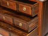 a marble top dresser with three drawers on it